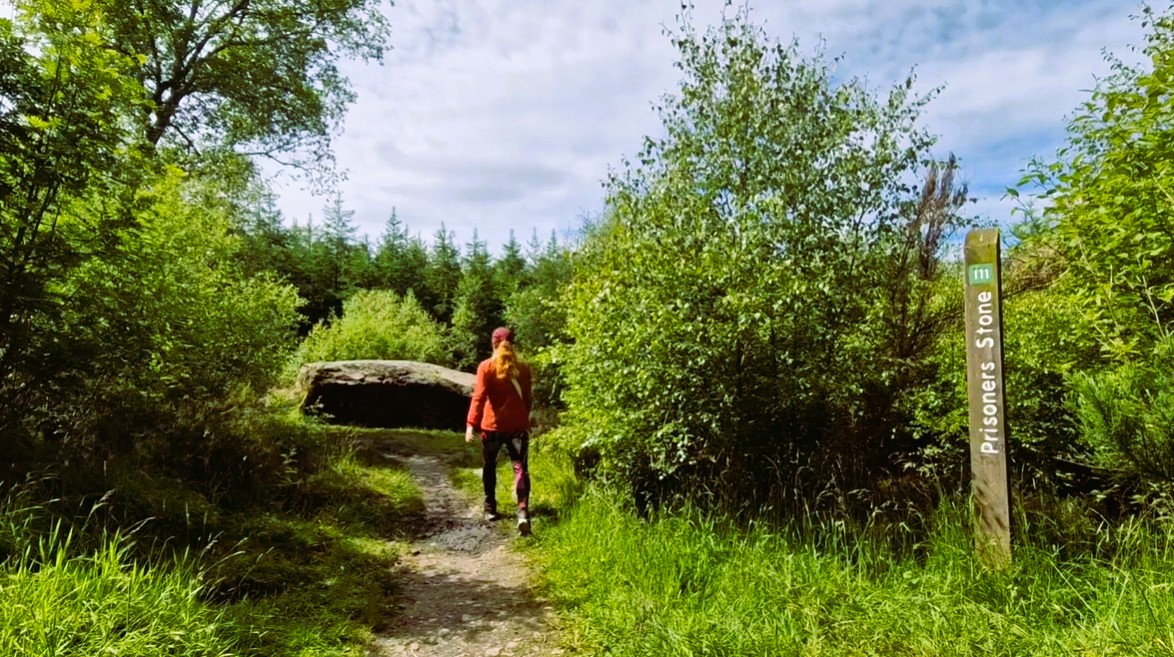 LeahinWanderlust walking to Prisoners' Stone in Culloden Woods