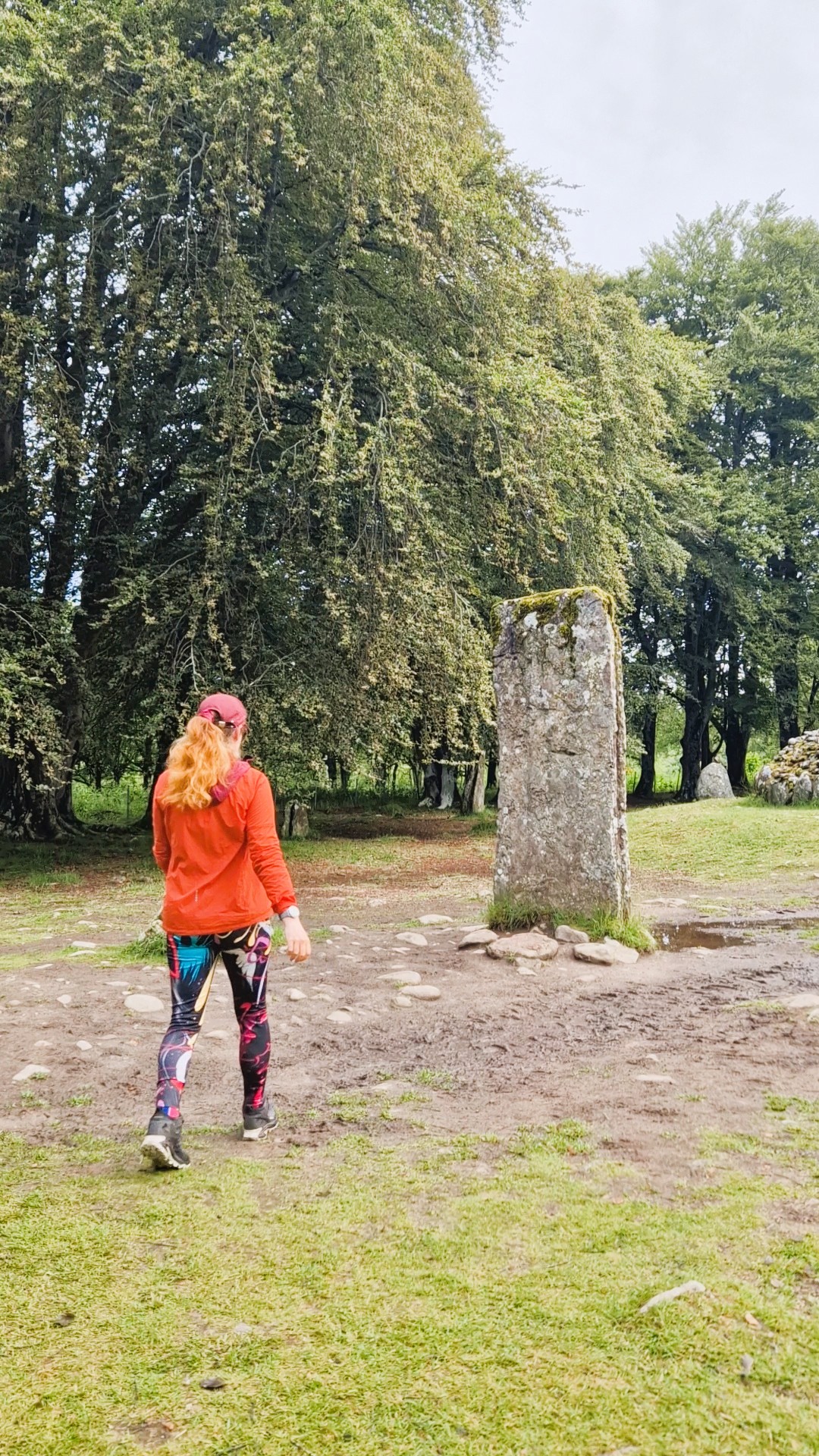 LeahinWanderlust walking towards Standing Stone at Clava Cairns