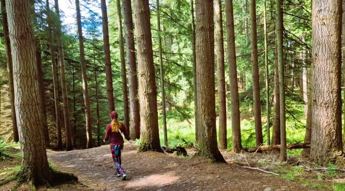 LeahInWanderlust walking through Culloden Woods